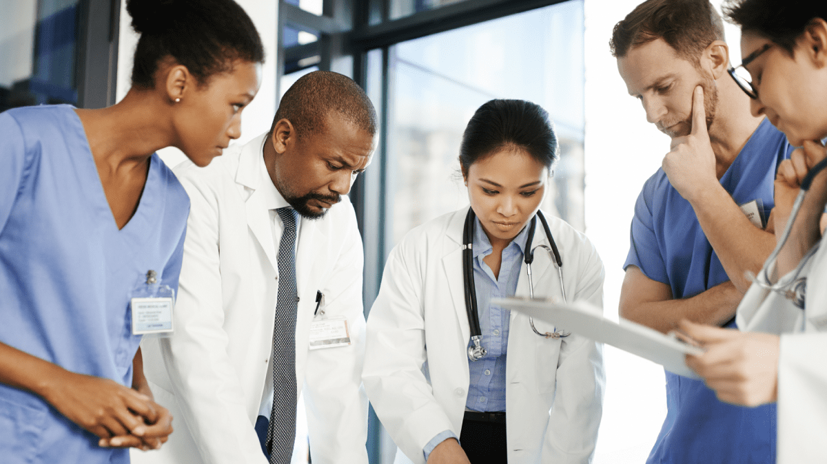 doctors in a circle talking about something