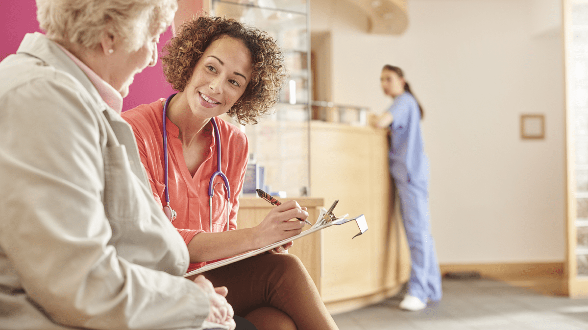 A physician asking a patient questions.