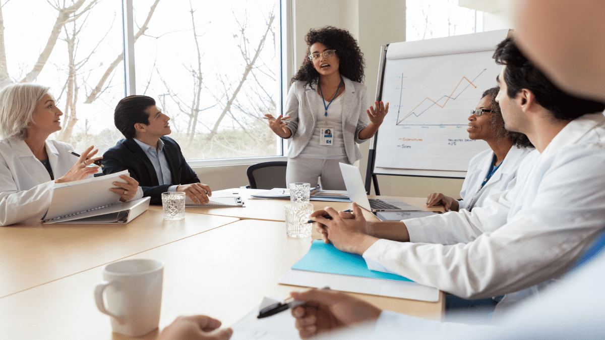 A healthcare leadership team in a hospital strategy presentation