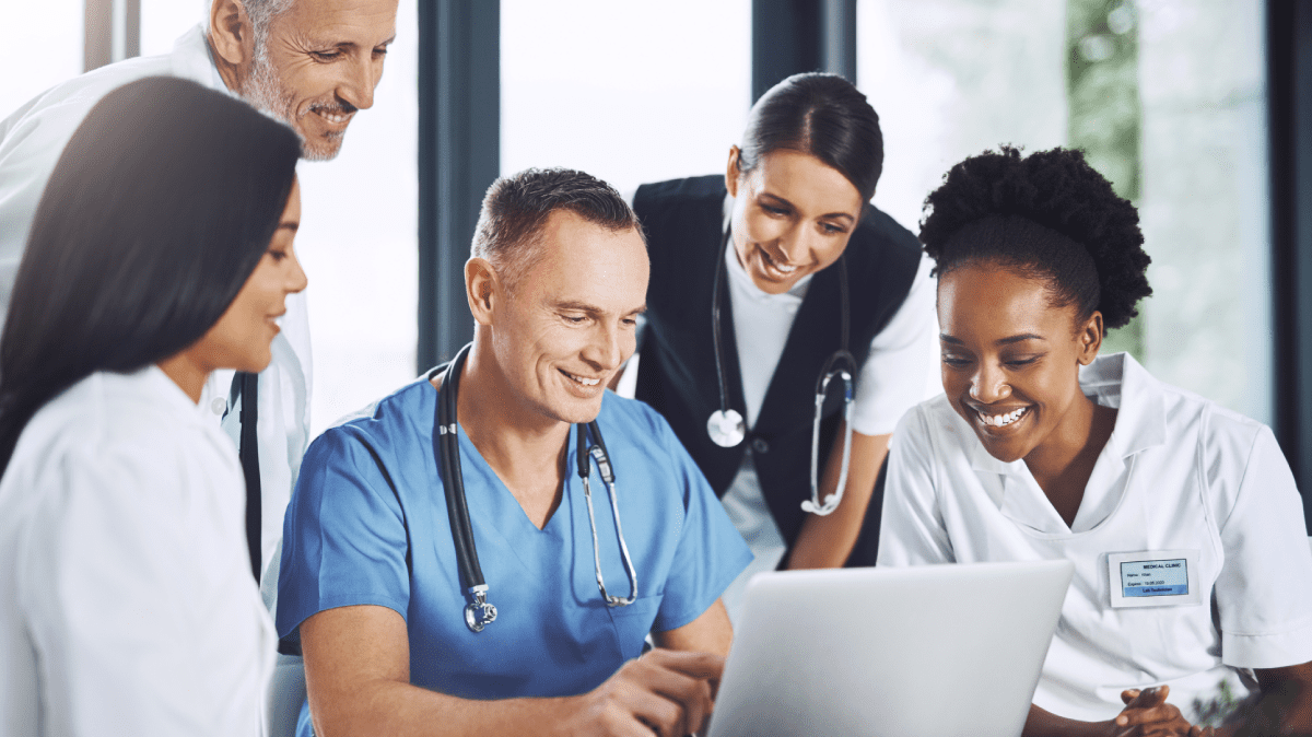 Group of physicians and hospital leaders review on computer